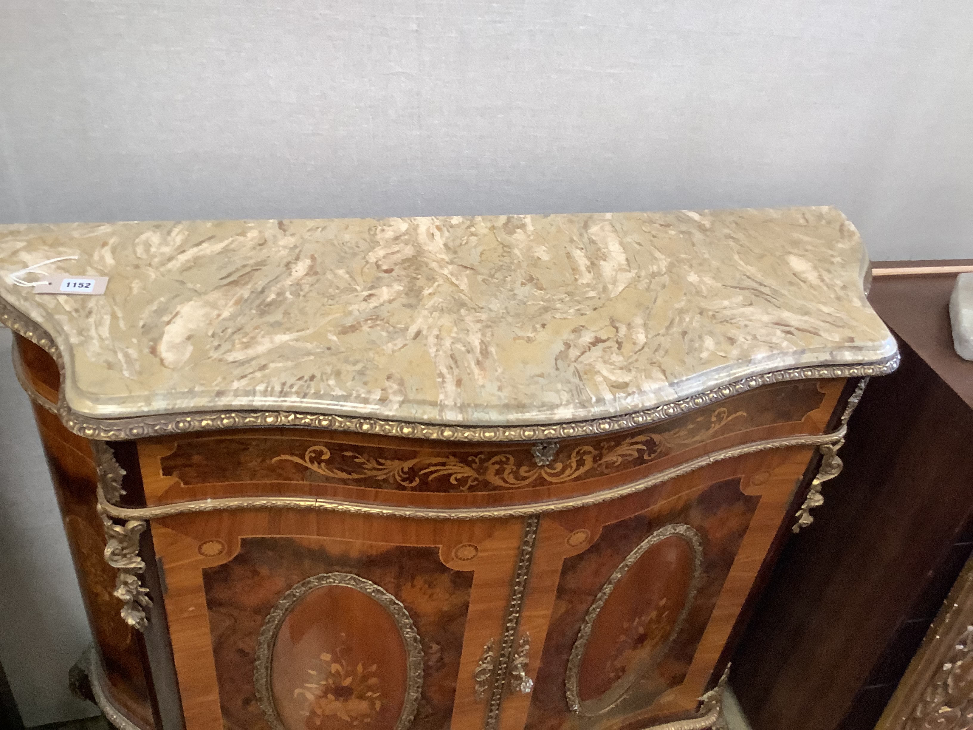 A Louis XV design walnut, kingwood and marquetry inlaid serpentine cabinet, length 116cm, depth 43cm, height 108cm